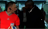 Referee Stuart Attwell (in red) was approached by Otto Addo over penalty decision