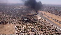 Smoke rising above the Khartoum International Airport amid battles between  two rival generals.