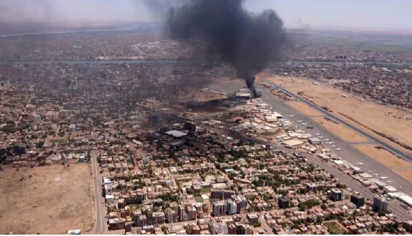 Smoke rising above the Khartoum International Airport amid battles between  two rival generals.
