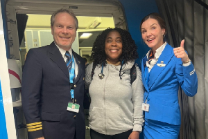 Dr. Addo Klah (middle) with Crew Captain Romkens and an airhostess