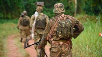 Uganda Peoples Defence Forces soldiers patrolling Ugandan side near the border with DRC