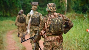 Uganda Peoples Defence Forces soldiers patrolling Ugandan side near the border with DRC