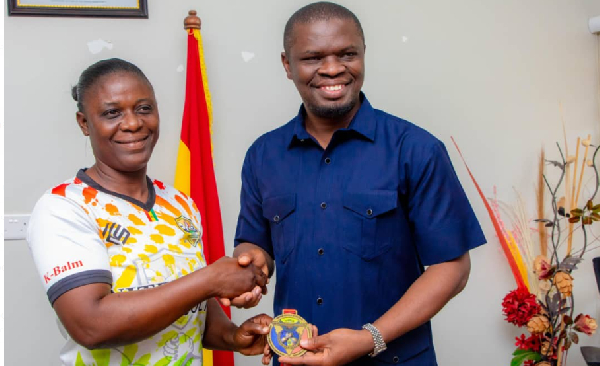 Sports minister meets world armwrestling champion Grace Minta