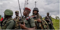 M23 rebels in Kibumba, a key highway in eastern DR Congo