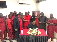 Prof. Mike Oquaye signing the book of condolence