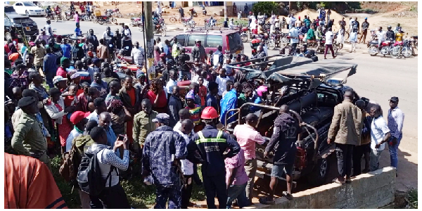 Residents gather as police remove the bodies from the scene on July 14, 2024.