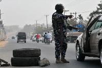 A police officer mans a checkpoint in Anambra State, southeast Nigeria, File: Pius Utomi Ekpei/AFP