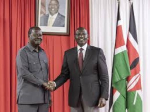 Kenyan President William Ruto  shakes hands with former archrival and veteran politician Railla