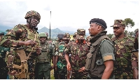 Kenya army Col Denis Obiero (left) talks with M23 spokesman Willy Ngoma in Kibumba