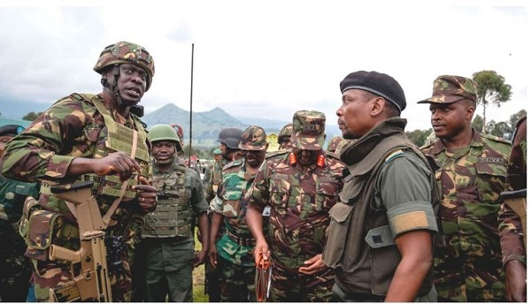 Kenya army Col Denis Obiero (left) talks with M23 spokesman Willy Ngoma in Kibumba