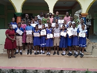 Basic pupils display the certificates they received after the  IT literacy programme
