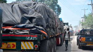 Cargo trucks from Tanzania ferrying tons of maize await offloading outside the Mombasa Maize Millers