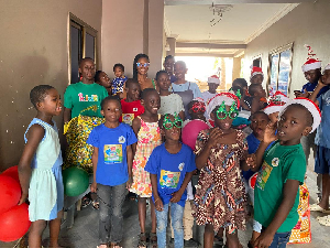 A photo of Ernestina Serwaa Asante and some children of Nyamedua Children's Home