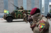 Guinean soldiers secure the area outside a polling station before Mamadi Doumbouya arrives