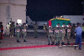 Soldiers carrying the remains of the former minister