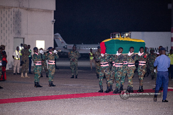 Soldiers carrying the remains of the former minister
