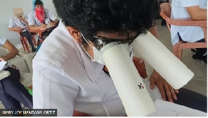 Student wear homemade goggles during one college exam for di Philippines