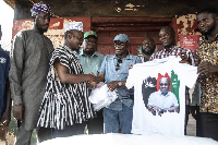 Ernest Agbesi presenting the items to some of the community leaders