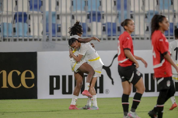 Players of the Black Queens celebrating