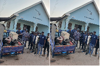 Mandari Wura (in a smock) with personnel of the Blue Water Guards and items seized from illegal mini