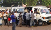 Ghanaians boarding a public transport