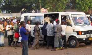 Ghanaians boarding a public transport