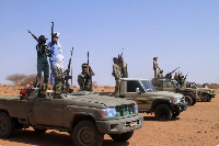 A group of armed defectors from the paramilitary Rapid Support Forces (RSF) arrive in vehicles