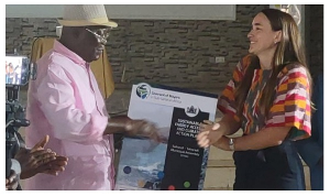 Shea O'Neil (Right) presenting the document to the Mayor of Sekondi-Takoradi, Abdul Mumin-Issah