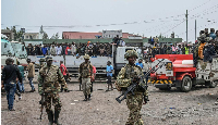 M23 rebels escort government soldiers and police who surrendered to an undisclosed location in Goma