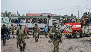M23 rebels escort government soldiers and police who surrendered to an undisclosed location in Goma