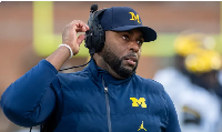 Former Michigan Wolverines head coach Sherrone Moore on the sidelines during a match