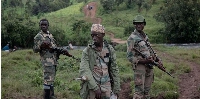 Members of APCLS militia patrol Kitshanga in eastern DRC