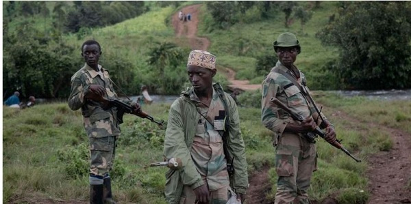Members of APCLS militia patrol Kitshanga in eastern DRC