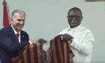 Kofi Adams gifts new Black Stars coach Carlos Queiroz fugu during presentation ceremony
