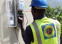 ECG staff working on a meter