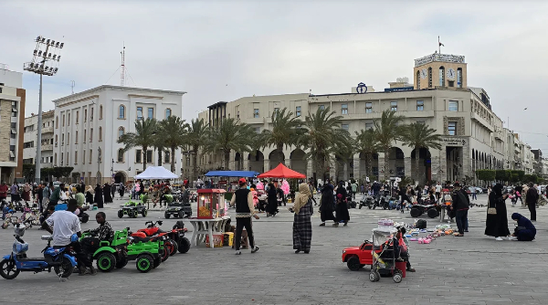 People walk in Martyr's square in Libya's capital Tripoli on May 10, 2025.