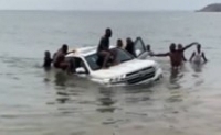 Rescuers pulling out the Toyota Land Cruiser of the chief of Krachi from the Volta Lake