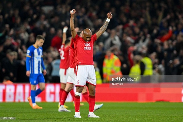 Dede Ayew with his face down and two hands up