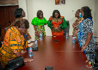 Assembles of God Miniter's wives praying with Gender Minister