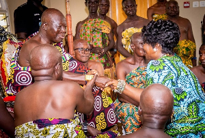 Otumfuo Osei Tutu II exchanging pleasantries with COP Maame Yaa Tiwaa Addo-Danquah