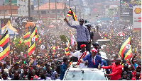Ugandan Presidential candidate, Bobi Wine, waves to supporters as he campaigns