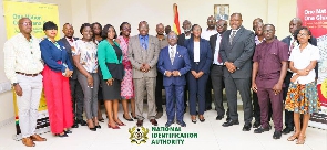 Leadership of NIA in a group photo with members of the Zambian Refugee Commission