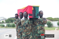 Soldiers carrying the mortal remains of the late Sani Victor Kwaku