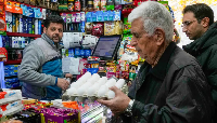 A man shops for eggs at a grocery store in northern Tehran, Iran