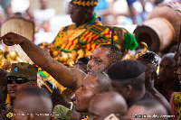 Dr. Matthew Opoku Prempeh (foreground with hand raised) and Otumfuo Osei Tutu II (background)