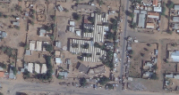 This satellite photo shows the Saudi Teaching Maternal Hospital, center, in El Fasher, Sudan
