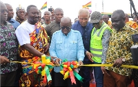 President Akufo-Addo (inset) cutting the tape to open the facility
