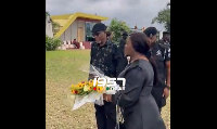 Justice Torkornoo laying a flower at the Ceremonial Gardens