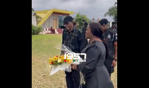 Justice Torkornoo laying a flower at the Ceremonial Gardens