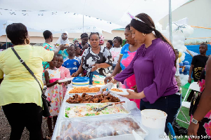 Lawyer Sarah Adwoa sharing food to some of the orphans